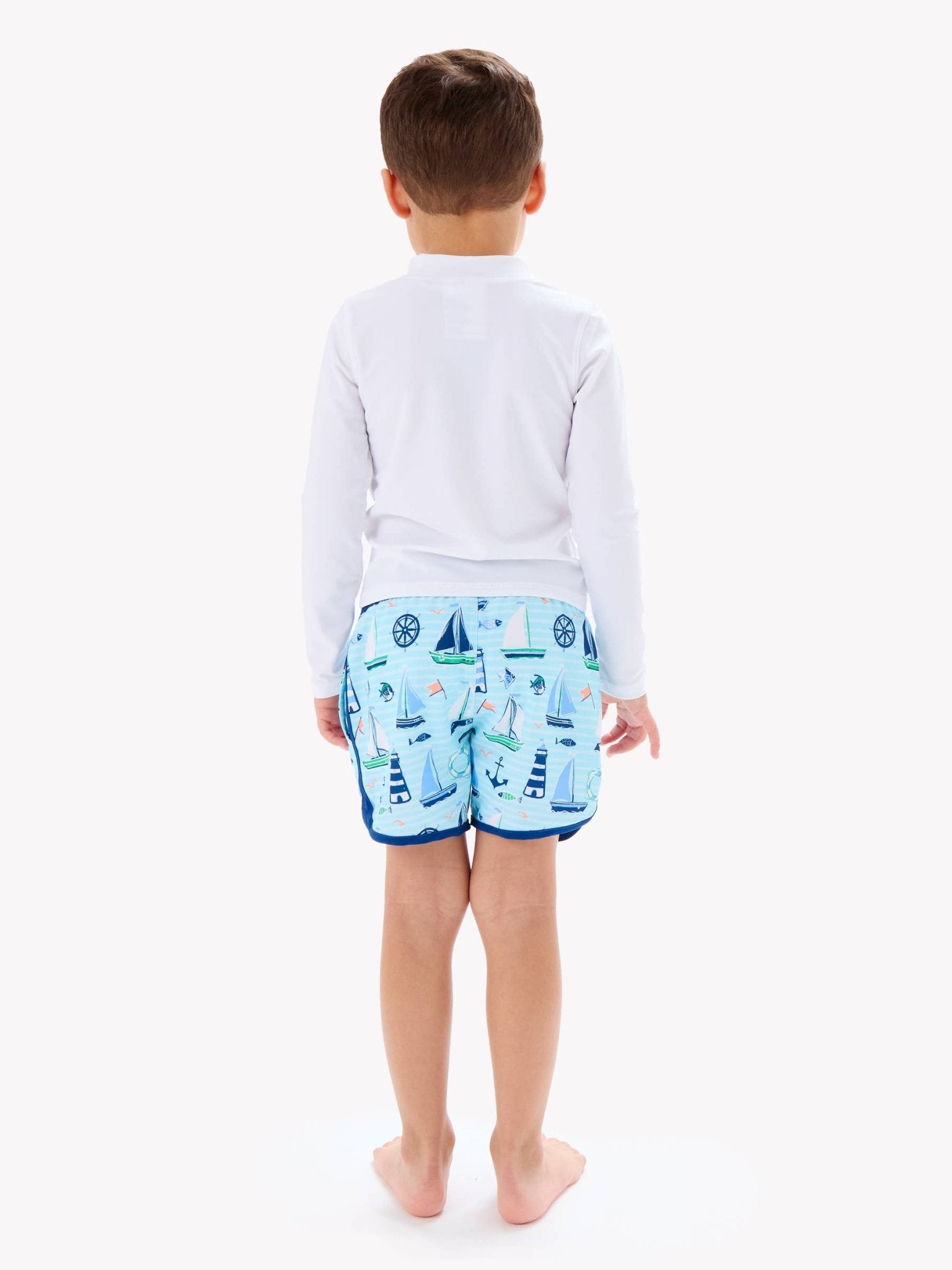 RuffleButts + RuggedButts - Boys Blue Sweet Sails Performance Hybrid Dolphin Hem Swim Trunks - For All Elements