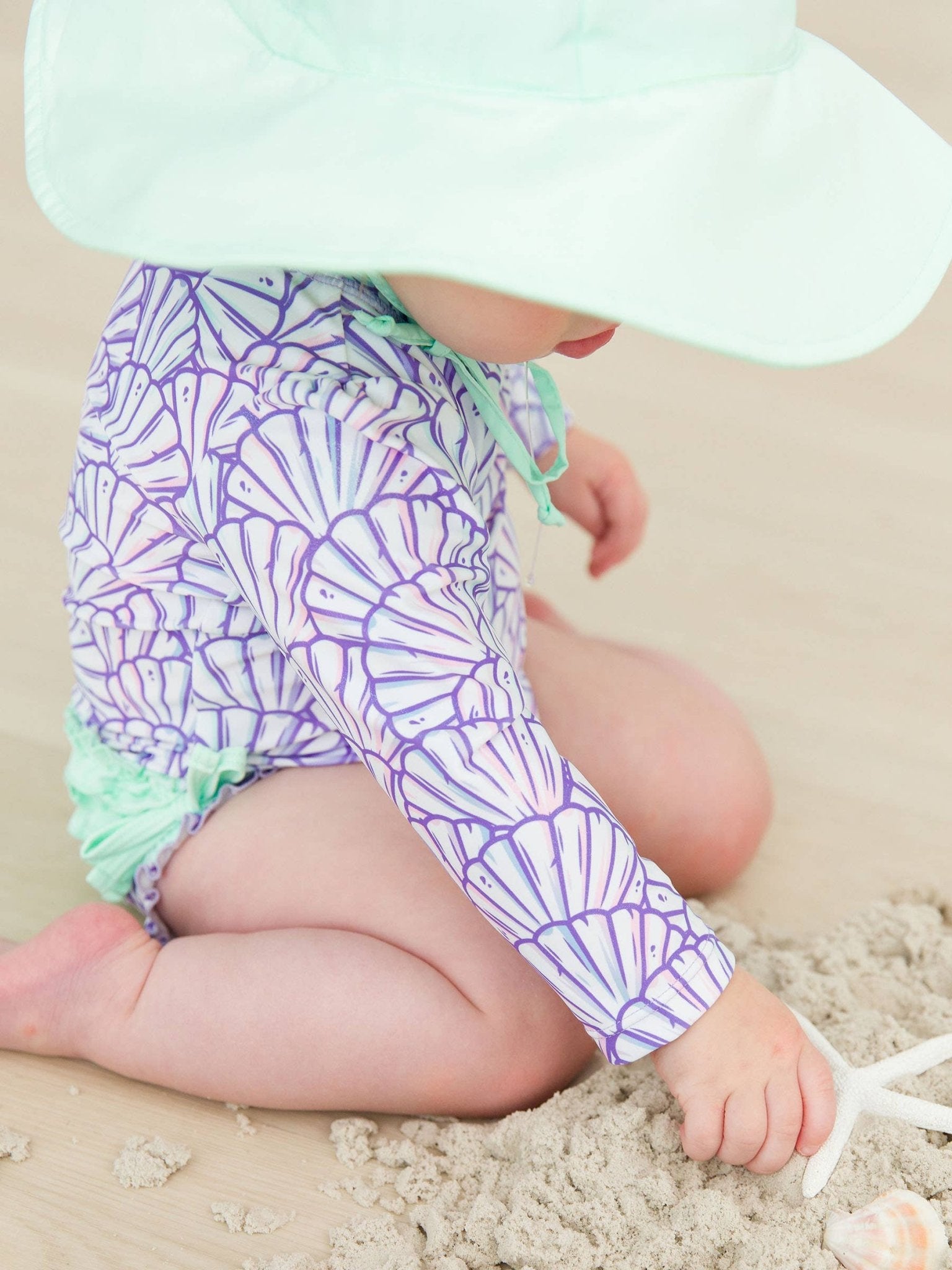 RuffleButts + RuggedButts - Baby Girls Magical Mermaid Long Sleeve One Piece Rash Guard Swimsuit with Signature Rear Ruffles - For All Elements