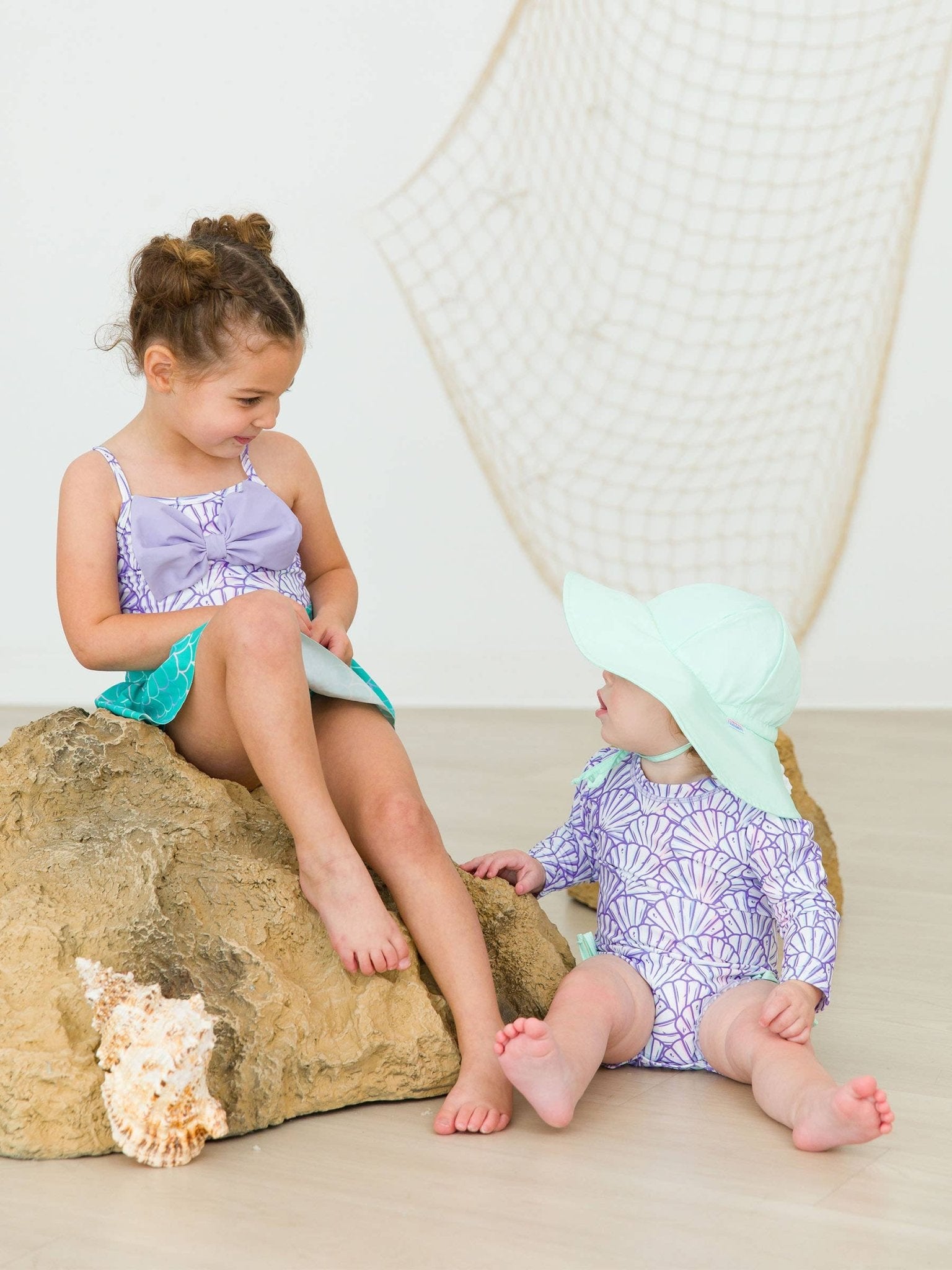RuffleButts + RuggedButts - Baby Girls Magical Mermaid Long Sleeve One Piece Rash Guard Swimsuit with Signature Rear Ruffles - For All Elements