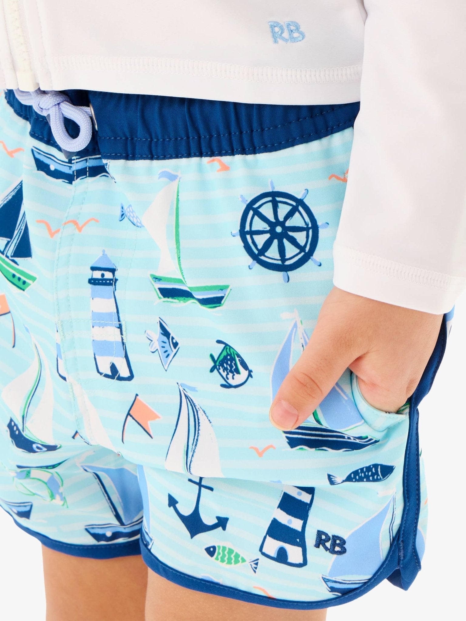 RuffleButts + RuggedButts - Boys Blue Sweet Sails Performance Hybrid Dolphin Hem Swim Trunks - For All Elements