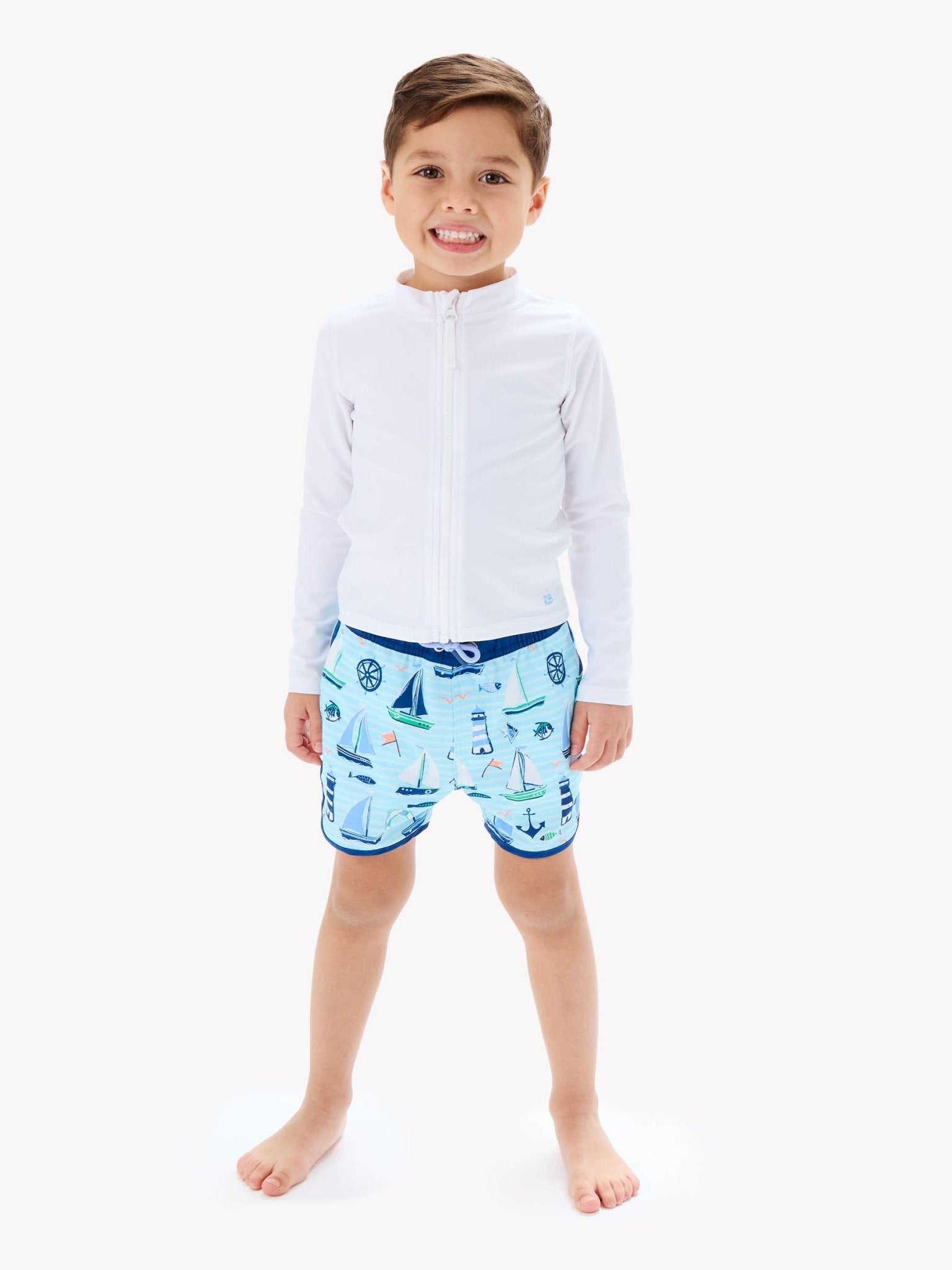 RuffleButts + RuggedButts - Boys Blue Sweet Sails Performance Hybrid Dolphin Hem Swim Trunks - For All Elements